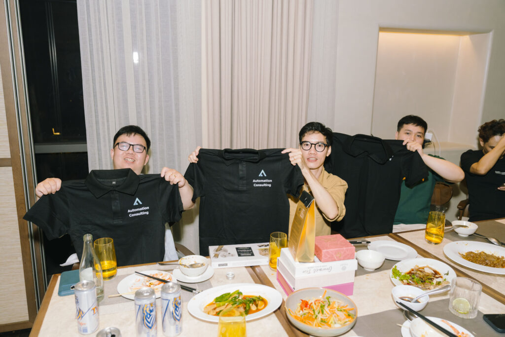 Team showing off AC merch